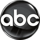 The image displays a logo consisting of a black circle with the lowercase letters 'abc' in white font, centered within the circle. The logo appears to have a glossy finish and is highlighted by a light reflection, giving it a three-dimensional effect. I