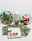 Christmas-themed paper plates, napkins, and cups on a white background