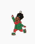 an ornament front featuring a young black girl smiling and wearing a green coat with ice skates