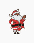 an ornament front featuring a black santa calus in his suit