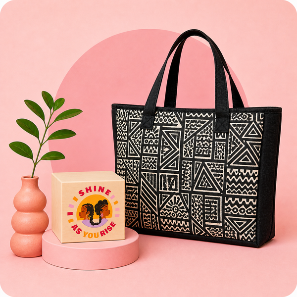 Black tote bag with geometric pattern on a pink background