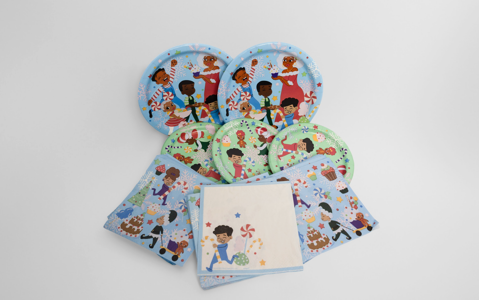 Set of children's plates and napkins with cartoon characters on a white background