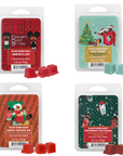 Four packages of scented wax melts with Christmas-themed designs and characters.