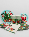 Christmas-themed paper plates, cups, and napkins on a white background