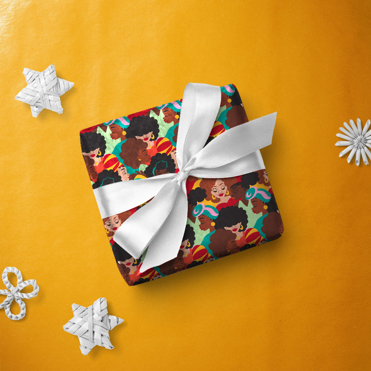 Gift box wrapped in All the Ladies gift wrap with a white ribbon