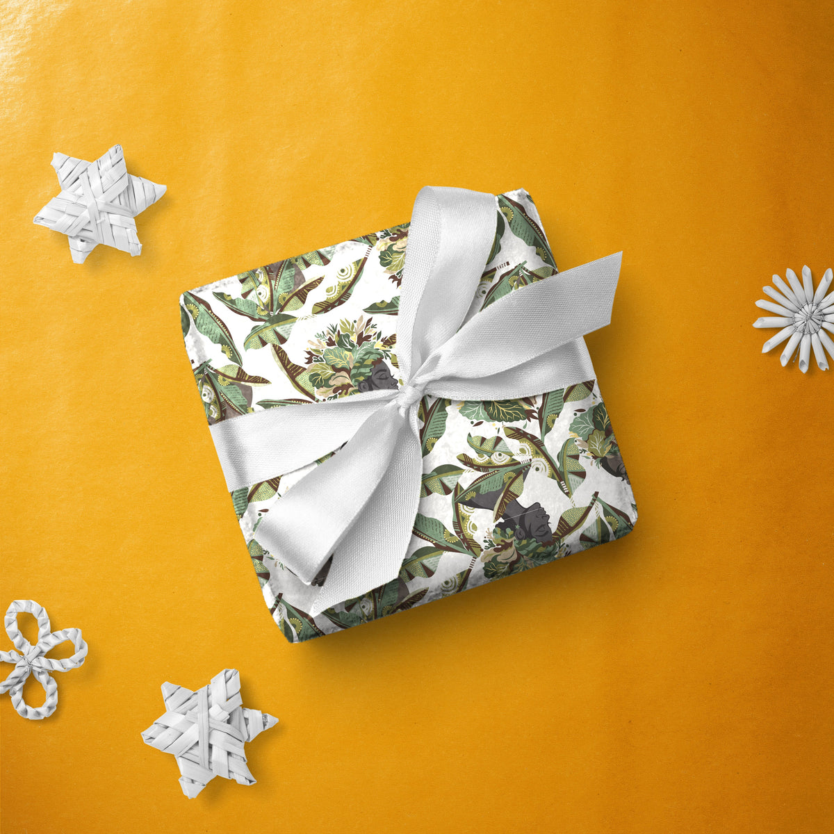 Gift box wrapped in Camo Collard gift wrap with a white ribbon
