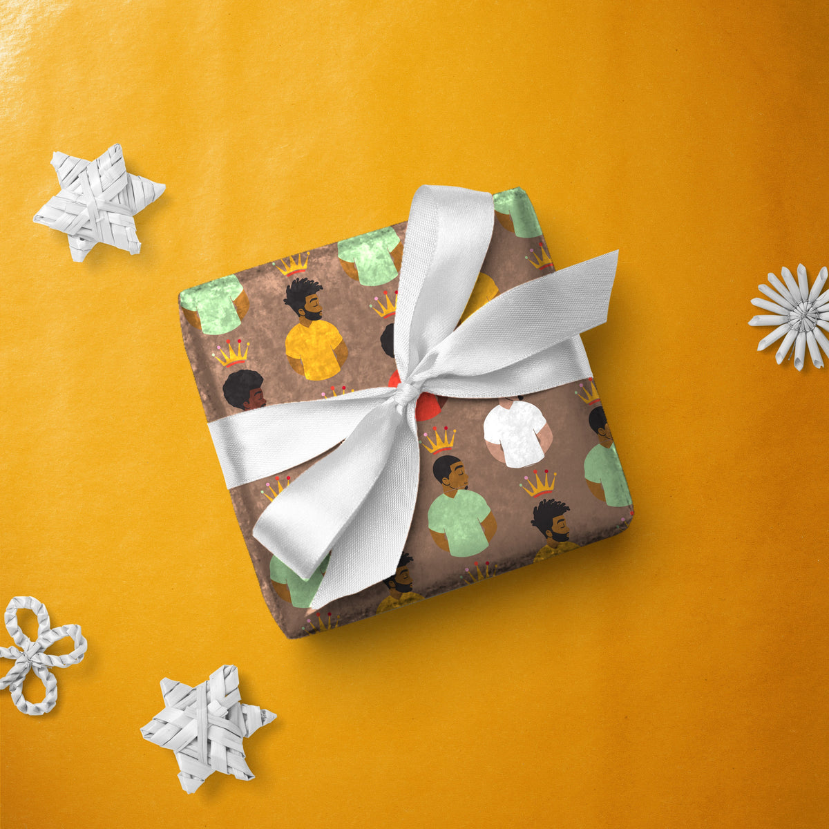 Gift box wrapped in Kings gift wrap with a white ribbon