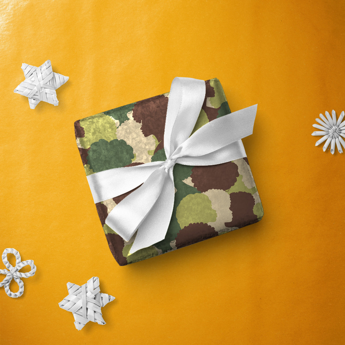 Gift box wrapped in Queen Camo gift wrap with a white ribbon