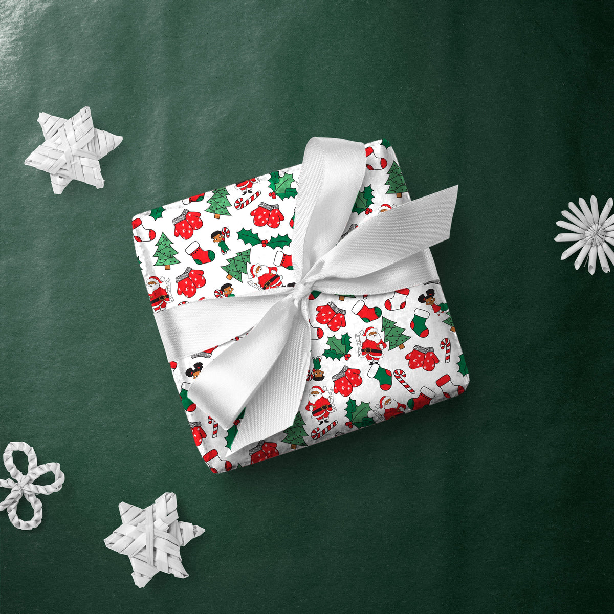 Gift box wrapped in Santa and Kids gift wrap with a white ribbon
