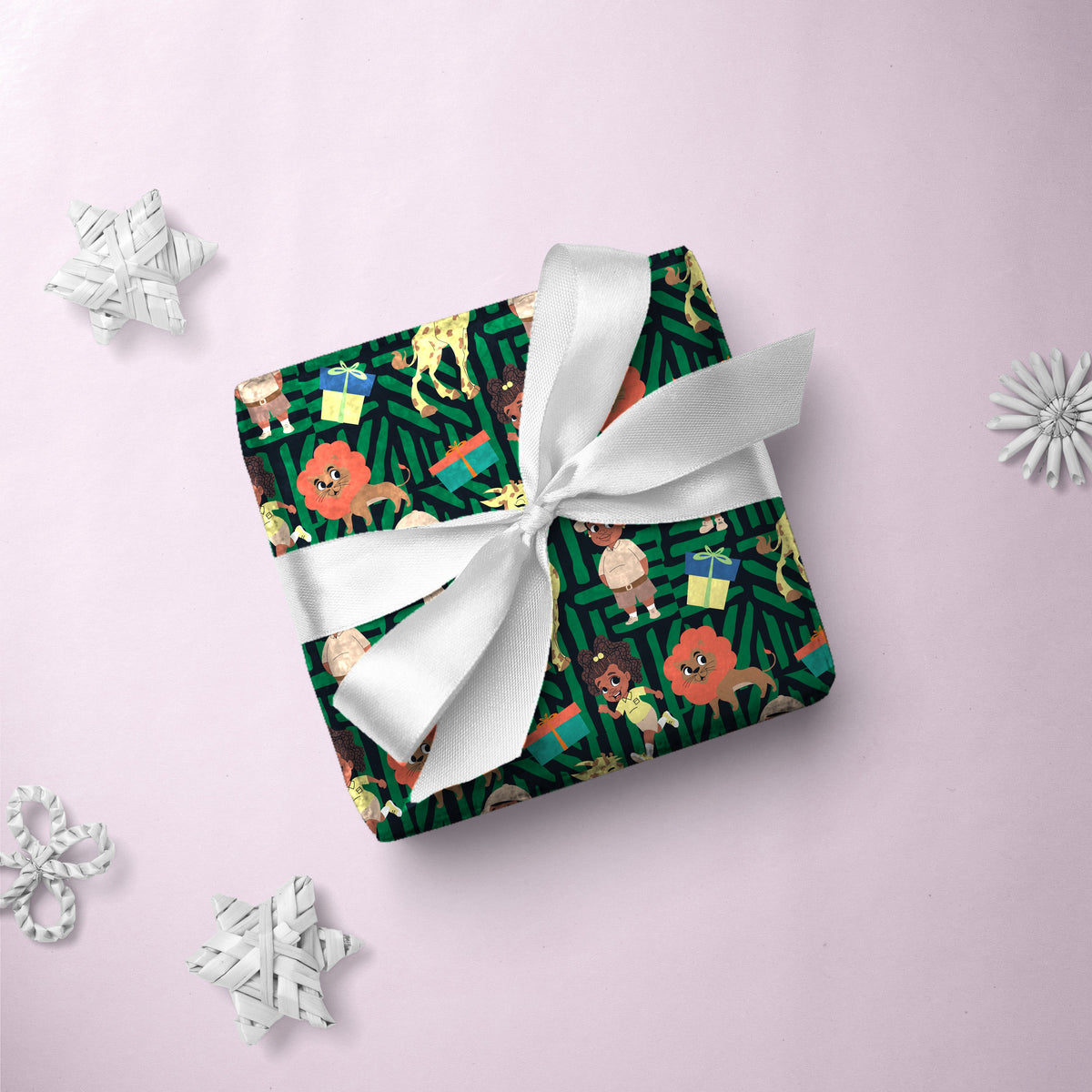 Gift box wrapped in Giraffe Safari Party gift wrap with a white ribbon