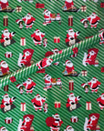 Letters to Santa gift wrap featuring Black Santa and gifts on a green background.