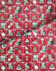 Letters to Santa gift wrap with holiday ornaments arranged in a red grid pattern.