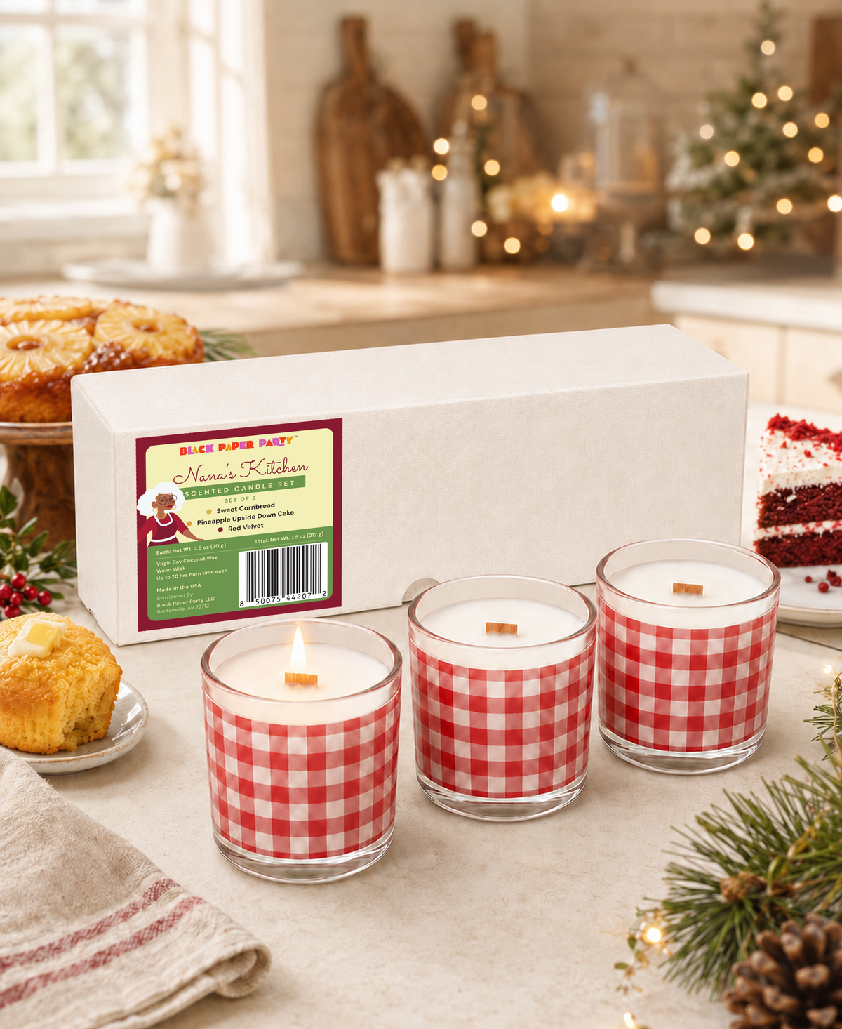 Three lit Nana’s Kitchen red gingham candles styled on a kitchen counter.