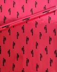 Noire Noel gift wrap with elegant Black couples illustrated on a magenta background.