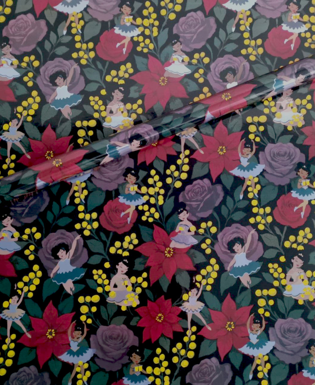 Noire Noel gift wrap with a dark floral pattern.